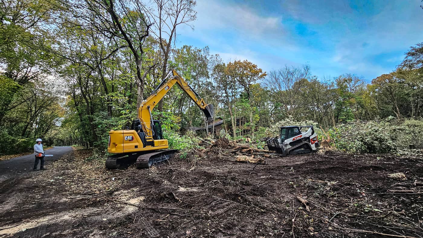 CAT Excavator and Bobcat on job site